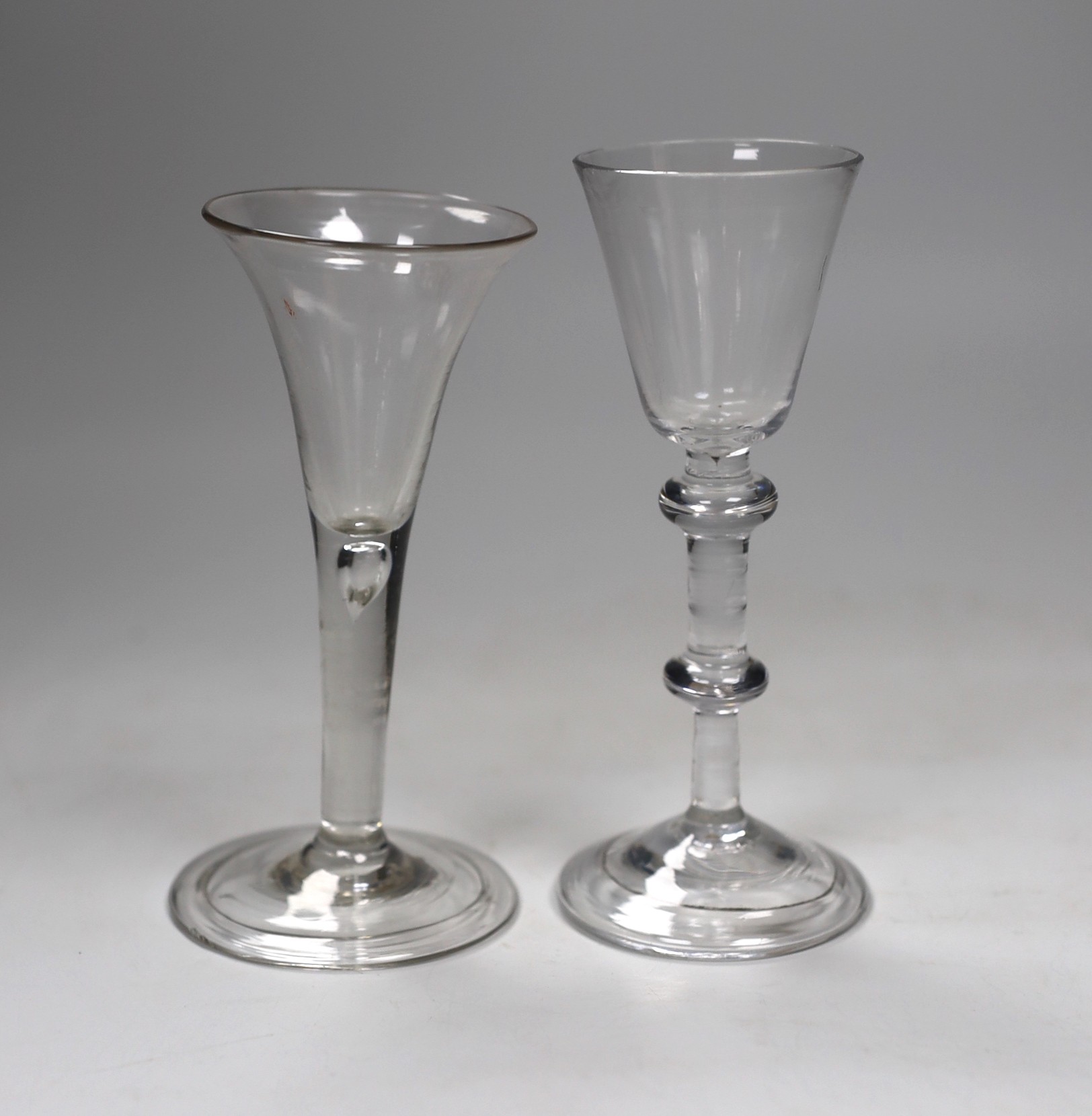 A George II double knopped stem wine glass and a similar ale flute, 16cm